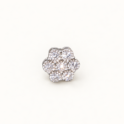 Silver Daisy stud earring on neutral ivory background