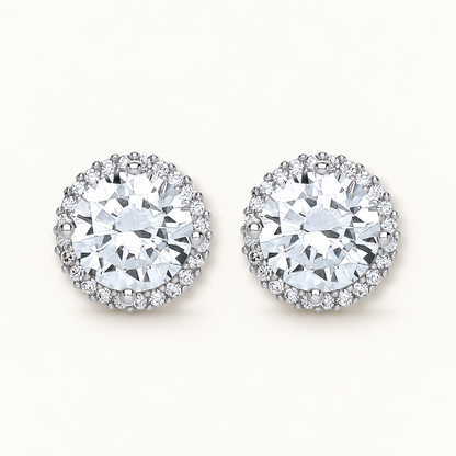 Silver CZ halo earrings on ivory background